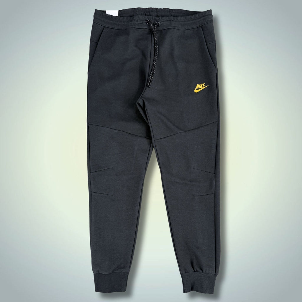 Nike Tech Fleece pánské sportovní kalhoty, grafitové, žluté logo. Premium kvalita